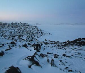 The three quad bikes are seen in the middle of the photo, in the distance. Parked on the land ice at Bandit’s hut.