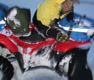 Rhys is seen wiping the snow off the quad bike in preparation for a morning departure.