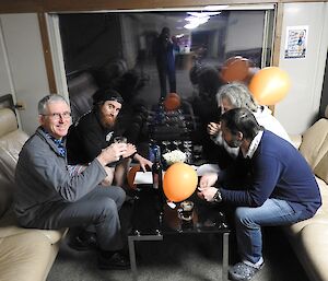 Team Orange sitting on the couches, ready to play: Rob, Shoey, Rhys, Tony and Marc (not photographed).