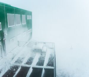 Blizzard swirling snow around the Living Quarters building.