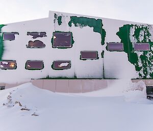 The day after the blizzard the LQ building is covered on the outside with snow. A large blizz tail has also formed.