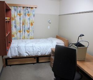 The old room layout with a desk, bookcase, bed and window.