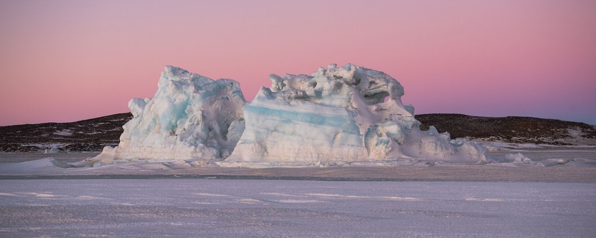 A grounded blue-striped iceberg on route to Watts hut.