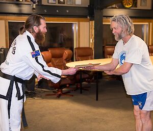 Rhys receiving his yellow belt qualification.