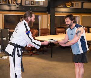 Tony receiving his yellow belt qualification.