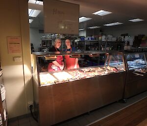 Kerryn and Daleen ready for midwinter brunch. They are standing behind the bay maree which is full of beautiful rich food.