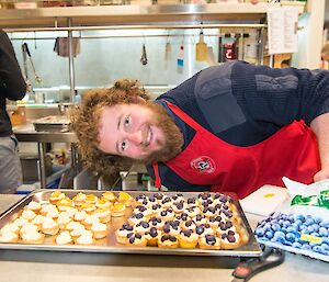 Jock helping make fruit tarts for dessert.