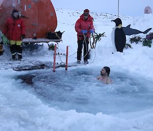 Tony in the icy water with just his head out.