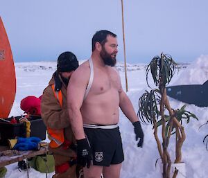 Marc getting a rope tied around his body ready for the plunge.