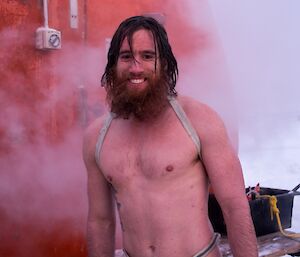 Shoey in bathers with the rope still tied around post-swim.