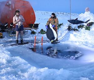 Jock doing a ‘Take 5’ pre-plunge, while Tony takes the penguin for a swim.