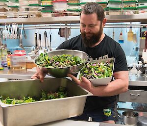 Marc with his harvest on midwinter’s day: three bowls of salad.