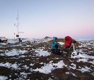 Daleen and Lötter are investigating the sea ice camera.