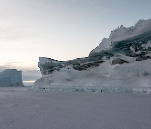 A berg with jade green sections.