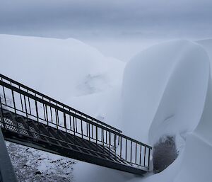 Nature’s latest art sculpture outside the living quarters. There are curvy dunes of snow everywhere!