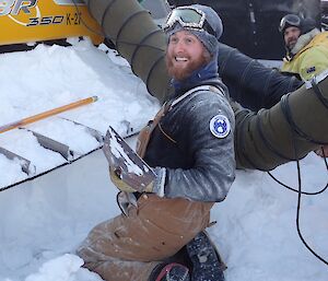 Bryce and Tony digging out the groomer.