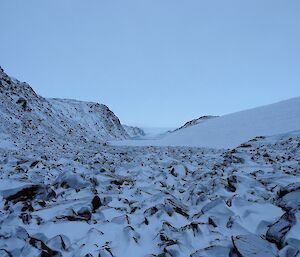 The ice ramp of Trajer Ridge is seen to the left of the rocky valley.