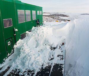 Attempting to clear the windows of snow so we can see the view again.