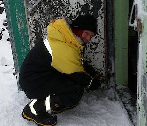 Rhys fixing the door at Bandit’s Hut.