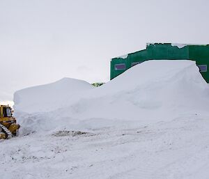 The dozer starts to clear the snow in front of the LQ.