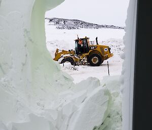 Bryce with a bogged loader while trying to clear snow.