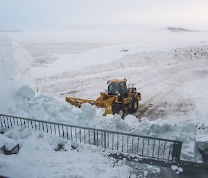 Clearing snow to reclaim the view in front of the living quarters building.