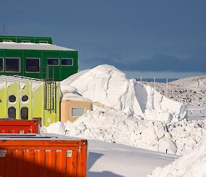 A view around station where buildings are still surrounded by snow.