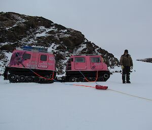 Jock (mechanic) directing us to winch the pink Hägg out of the ditch. The ropes are attached to structural points on the cabs and the Hägg will be pulled in an arc back onto even ground.