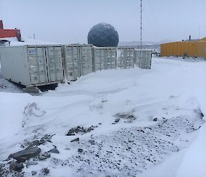 The containers holding the new furniture are surrounded by snow and will need excavating before we gain access.