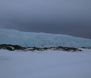 The Sørsdal Glacier under a dark snow cloud — bringing out the blues in the ice.