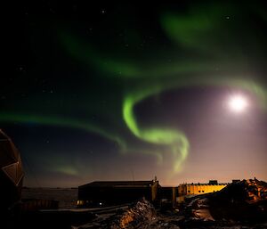 A green ribbon looking aurora over Davis station. You can also see the sun.