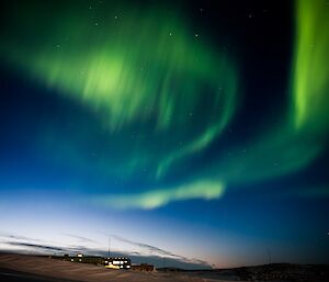 More green aurora lights in the sky.