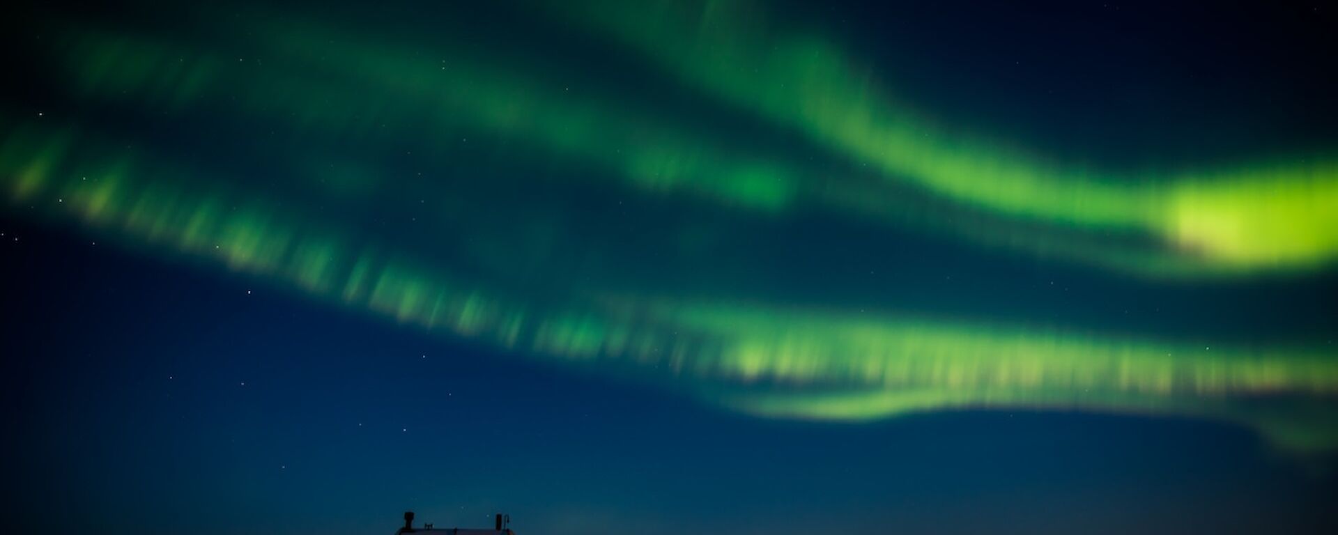 Auroras over Davis station — three bands are visible.