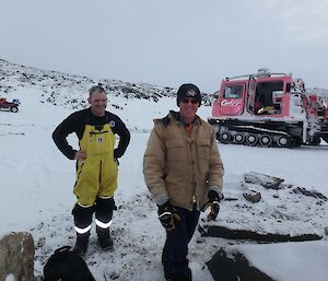 Barry B2 and Rob are standing in front of the pink Hägglunds.