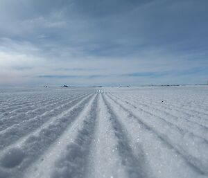 The corrugated surface of a groomed runway.