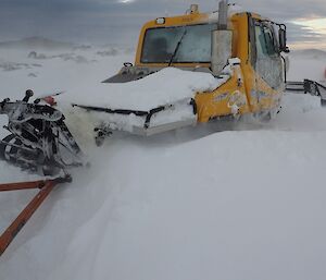 The groomer didn’t fare so well getting buried up to the doors in blizz.