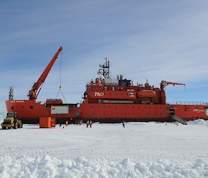 Ship in sea ice with cargo operations taking place.