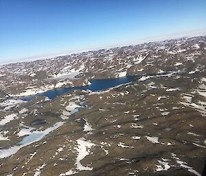 Rocky hills and lakes.