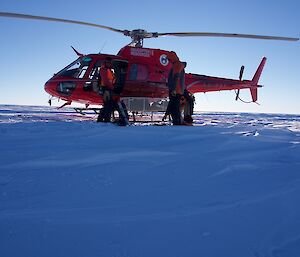 Helicopter landed on the snow.