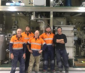 A group of people in front of a water treatment plant