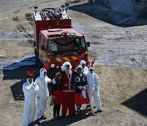 People dressed as Santa, elves and reindeer