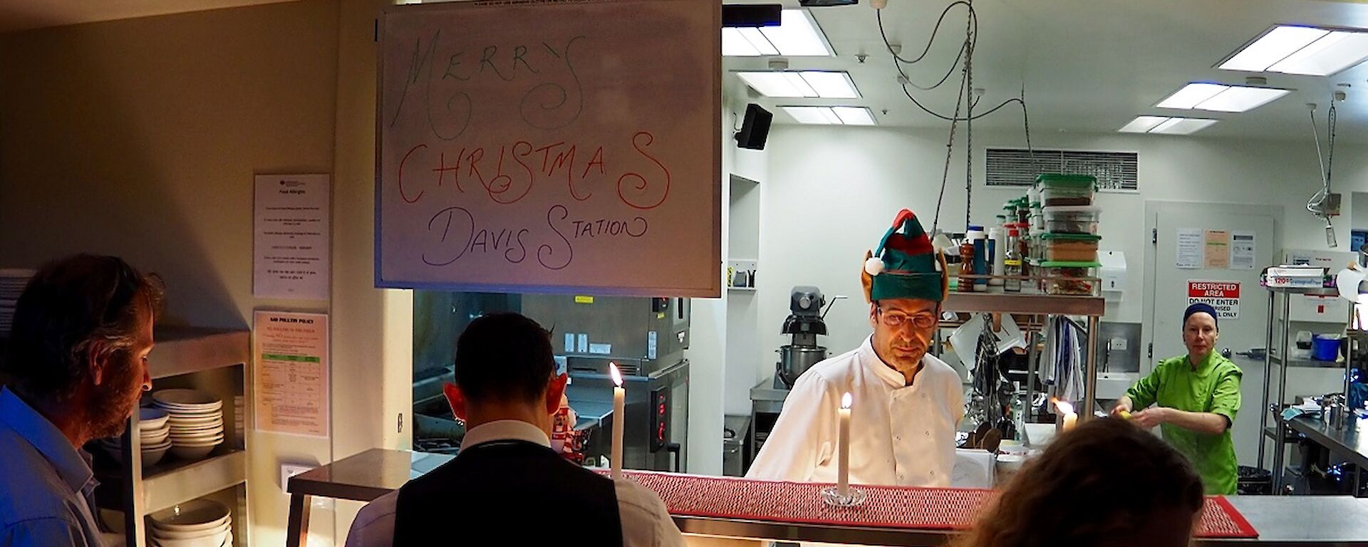 Chefs stand behind the servery