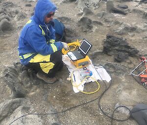 A man in the field with laptop