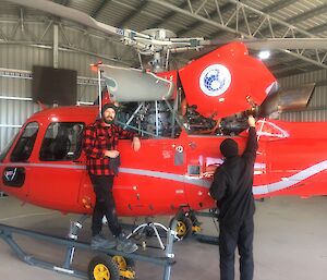 A helicopter being cleaned