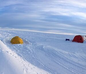 A campsite with tents on snow