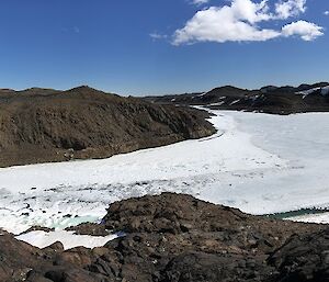 a wide view of ice and hills