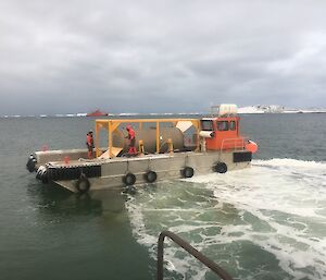 A barge with water tank on board