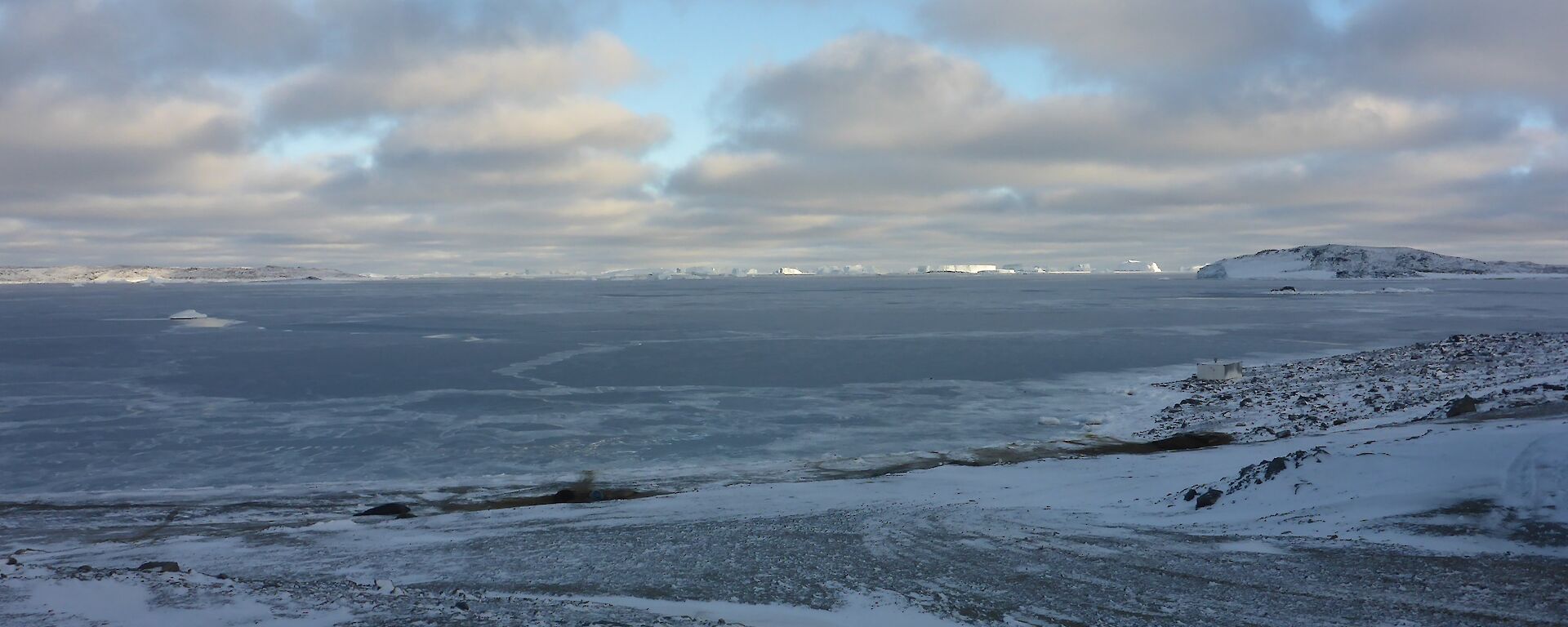 Looking over the bay in front of station at the new ice forming on cloudy day.