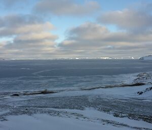 Looking over the bay in front of station at the new ice forming on cloudy day.