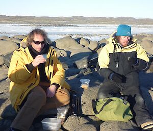 Derryn and Steve enjoy a break at Lake Island on the rocks with a cup of hot chocolate.